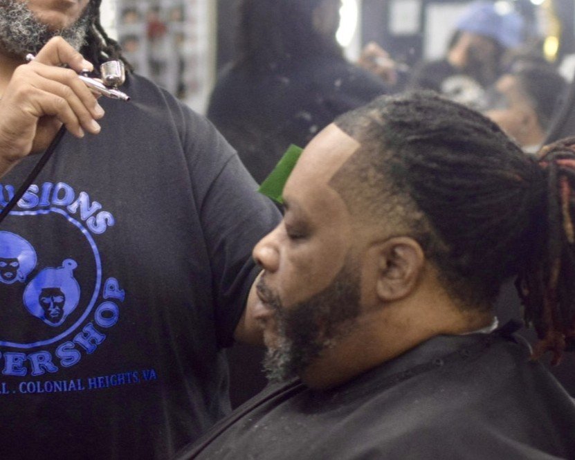 a man getting his hair cut